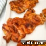 Sun-Kissed Suppers Made Simple 6 A platter of beautifully smoked chicken thighs, ready to be served.