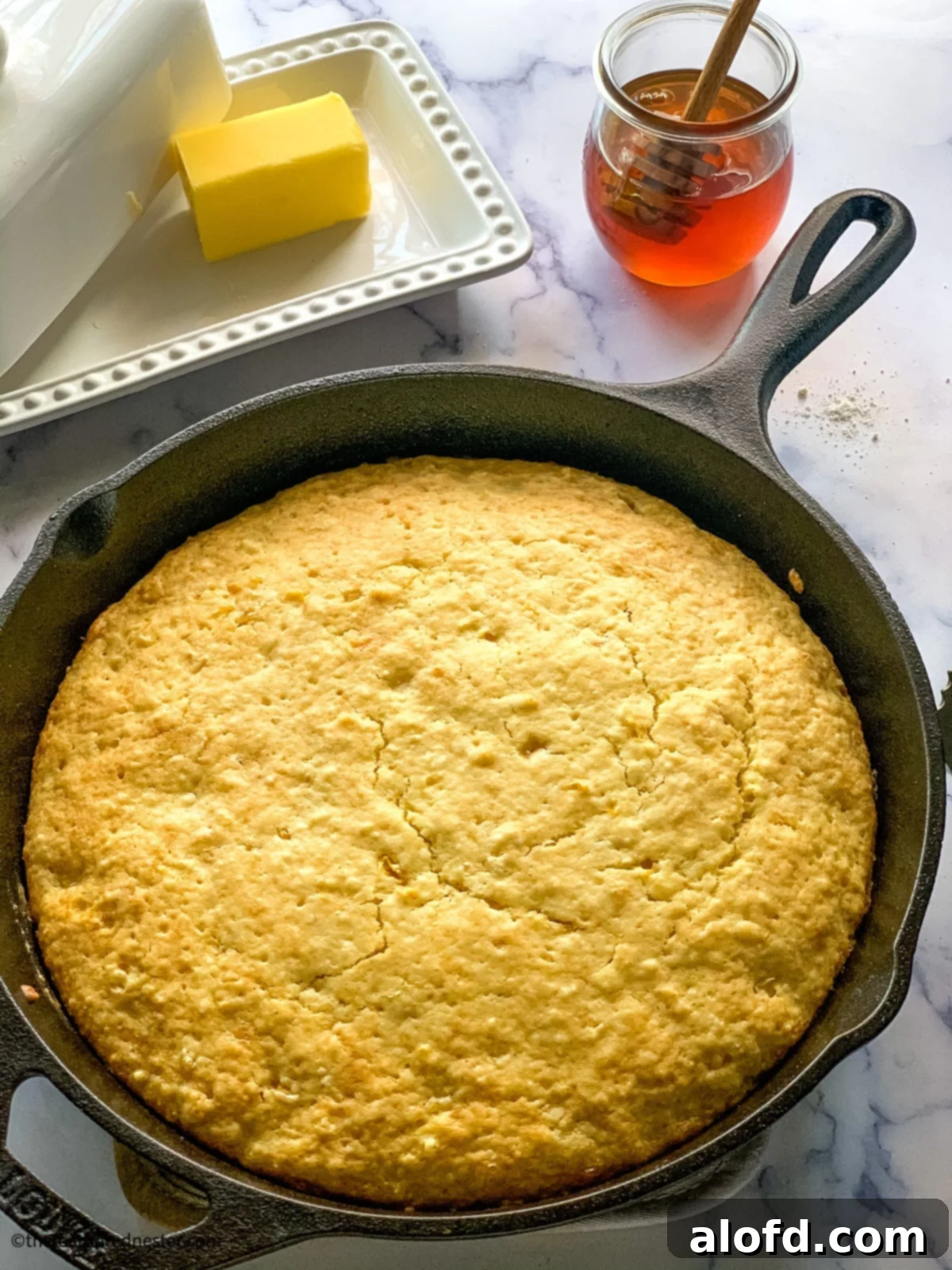Bisquick Cornbread No Cornmeal Needed 2 Quick bread in a skillet, showcasing a golden-brown, moist texture perfect for a Southern-style meal.