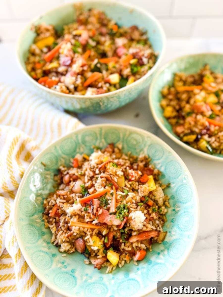 Blackstone Dinners Made Simple 9 Two green bowls of Blackstone fried rice with a larger green serving bowl on the right, perfect for sharing.