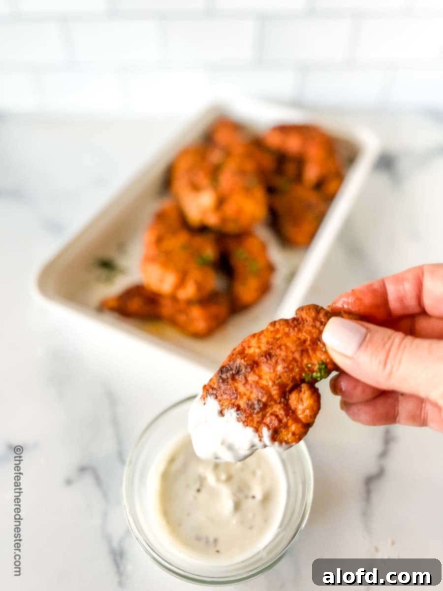Nashville chicken tenders dipped in blue cheese dressing.