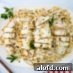 Garlic parmesan chicken pasta on a white serving plate.
