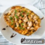 Hawaiian chicken and fried rice in a pineapple bowl.