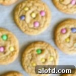 Close-up of spring sugar cookies adorned with pastel M&Ms.
