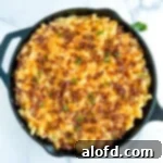 Lunchbox Hacks for Educators 13 A cast iron skillet filled with indulgent smoked mac and cheese, generously topped with crispy bacon.