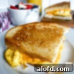 Lunchbox Hacks for Educators 21 One half of a delicious sourdough breakfast sandwich perfectly placed on a small plate, ready to be enjoyed.