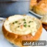Harvest Bowls and Loaves 16 San Francisco Clam Chowder in a bread bowl on a white plate.