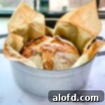Harvest Bowls and Loaves 20 staub dutch oven with a loaf of overnight sourdough bread cooling.