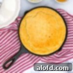 Harvest Bowls and Loaves 22 a cast iron skillet with cornbread with self rising flour and a striped red kitchen towel at the back.