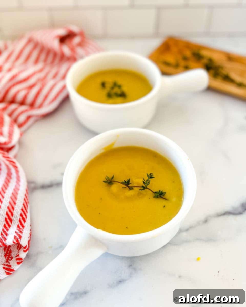 Harvest Bowls and Loaves 5 two white bowls with squash soup.