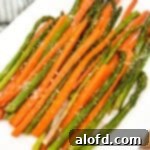 A plate of roasted carrots and asparagus.
