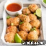 sweet chili meatballs with slices of lime places in a baking sheet.