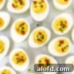 Spicy deviled eggs with garnish.