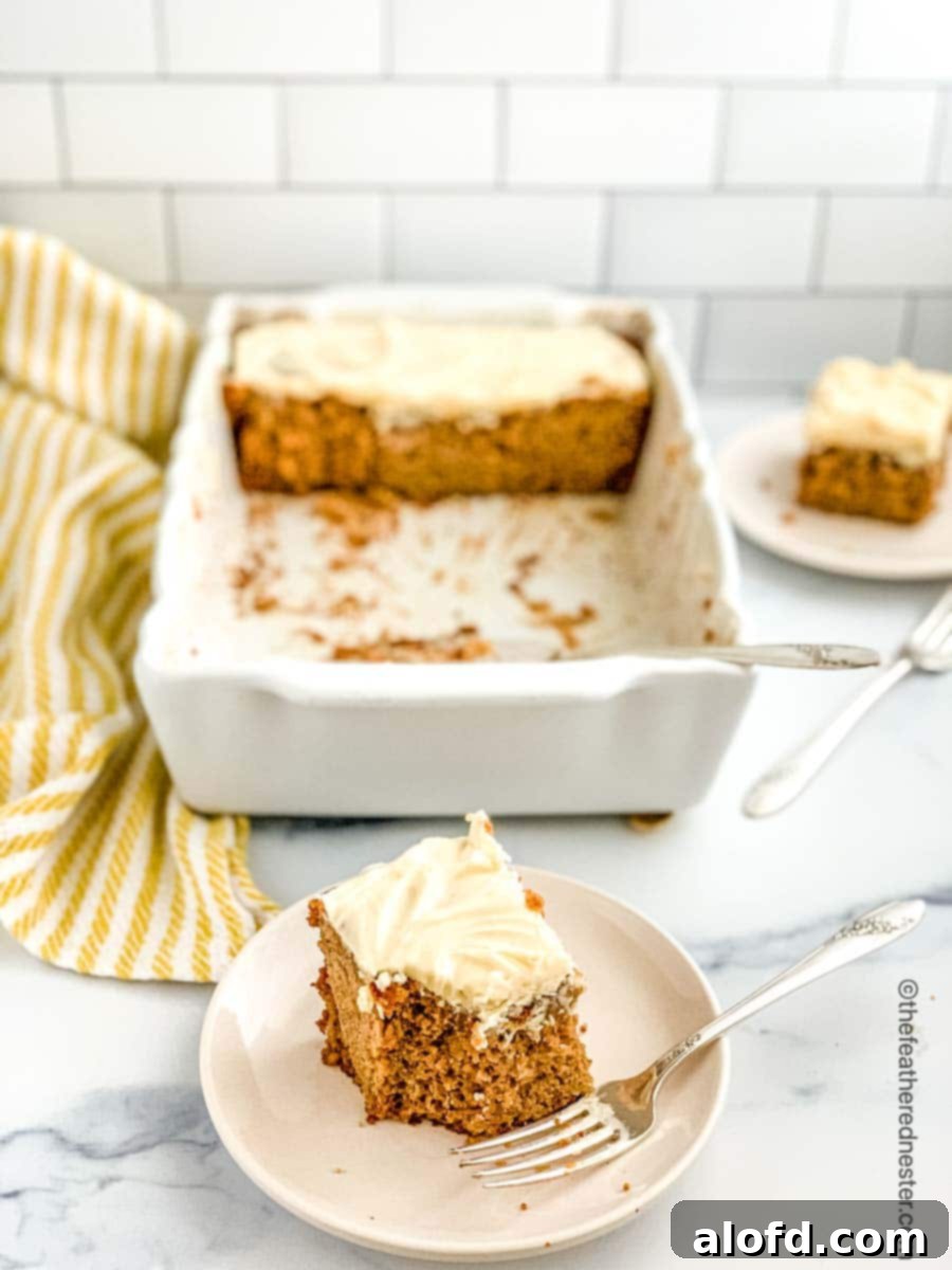 A plated slice of sourdough apple cake, with the remaining apple cake visible in a baking dish behind it, creating a rustic and inviting scene.