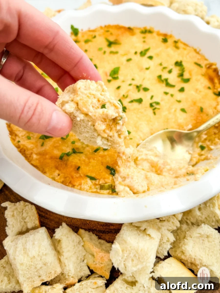 Game Day Grub 11 Croutons dipped in a bowl of cajun crab dip with shrimp.