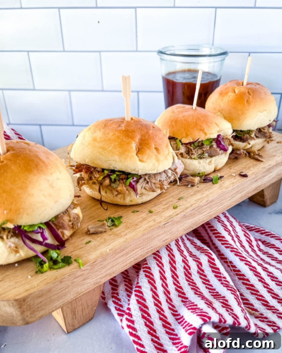 Game Day Grub 17 Game day sandwiches filled with Dutch oven pulled pork, served on buns.