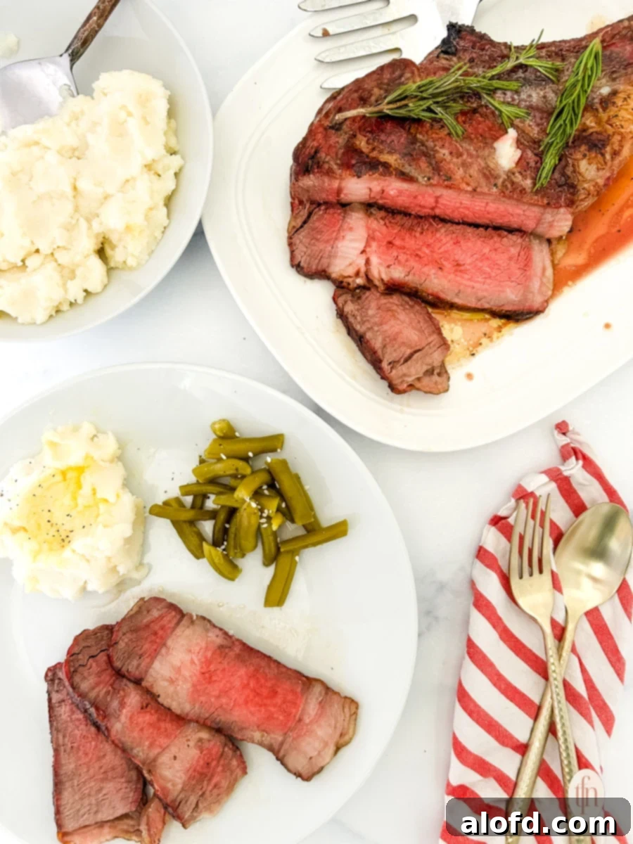 Game Day Grub 22 A plate of sliced cowboy ribeye with a bowl of mashed potatoes and a prepared plated dish for cowboy ribeye.