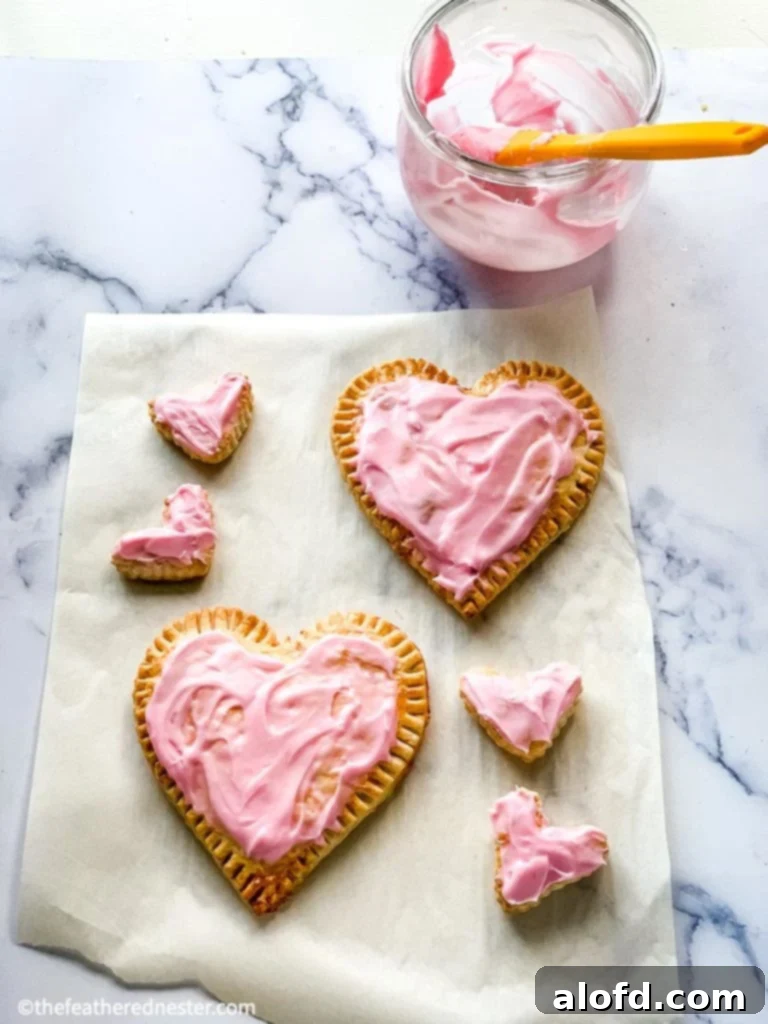 Cupid's Confections 5 Best heart shaped desserts for Valentine's pastries, displayed with a delicate pink icing.