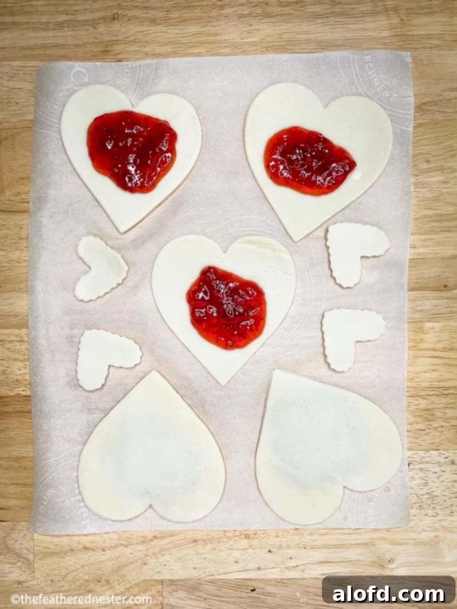 Cupid's Confections 6 Valentines Day Hand Pies made from pie crust, being prepared on a baking sheet.