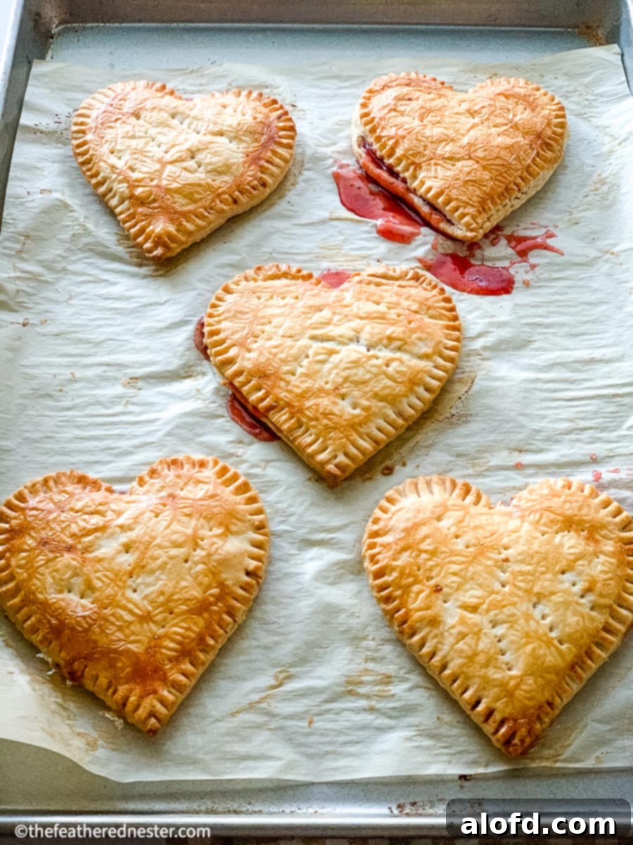 Cupid's Confections 8 Heart shaped desserts become Valentine's Day treat ideas thanks to premade pastries dough, decorated with pink icing.
