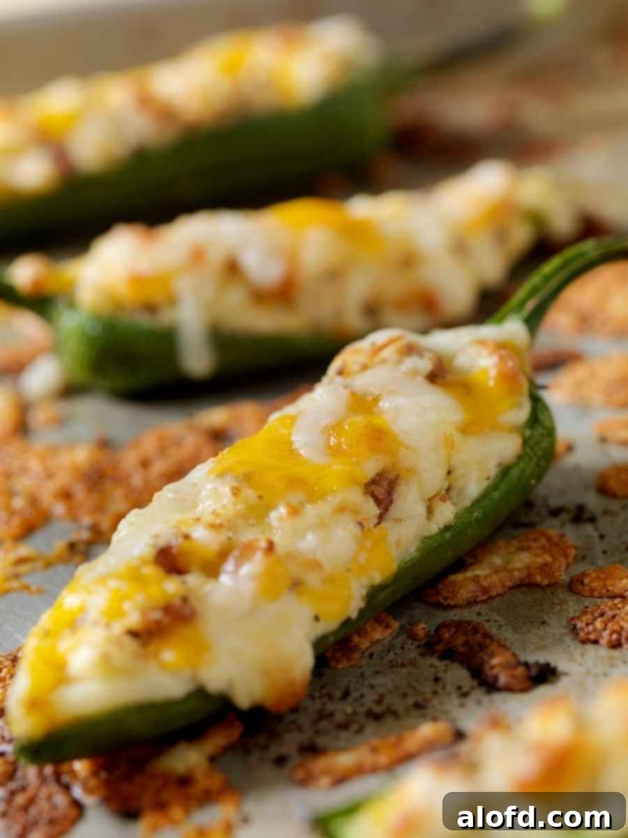 Ultimate Jalapeno Poppers 6 Tray of perfectly baked stuffed jalapeno poppers, golden and ready to serve.