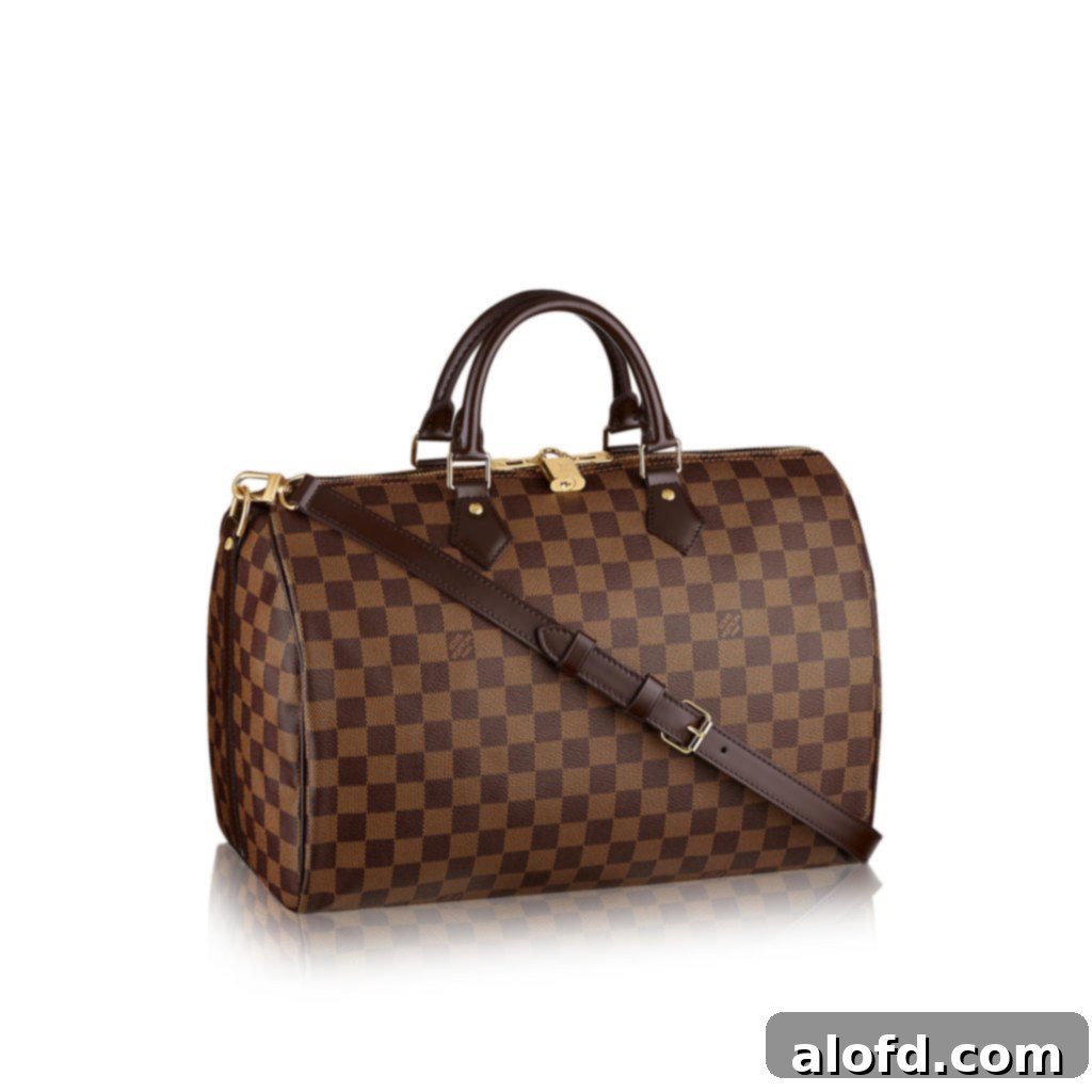 My Life in Handbags: A Passionate History 13 The Louis Vuitton Speedy Bandouliere 35 in Damier Ebene canvas with its detachable strap.