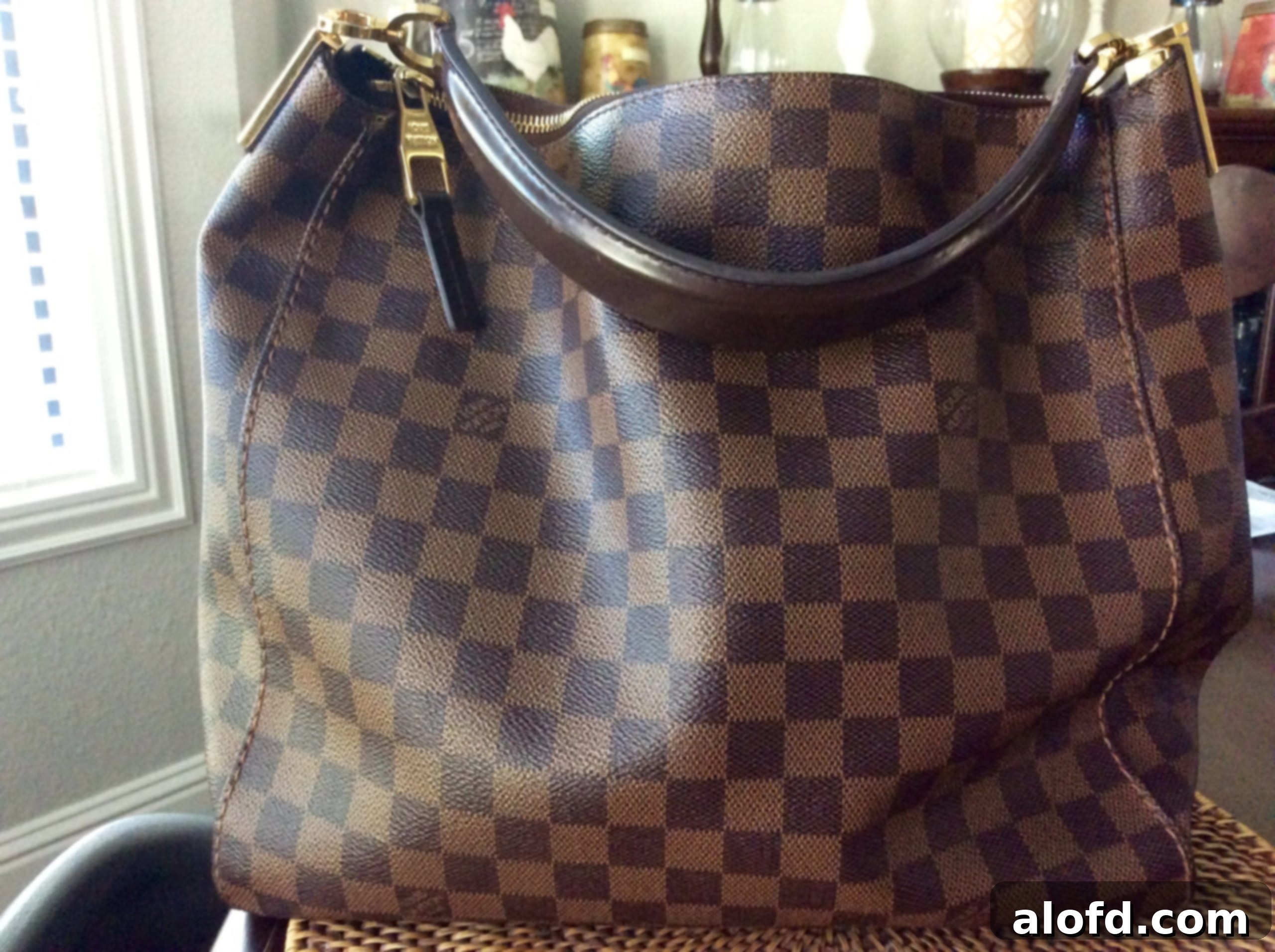 My Life in Handbags: A Passionate History 7 Current state of the Louis Vuitton Portobello bag, showing signs of wear.