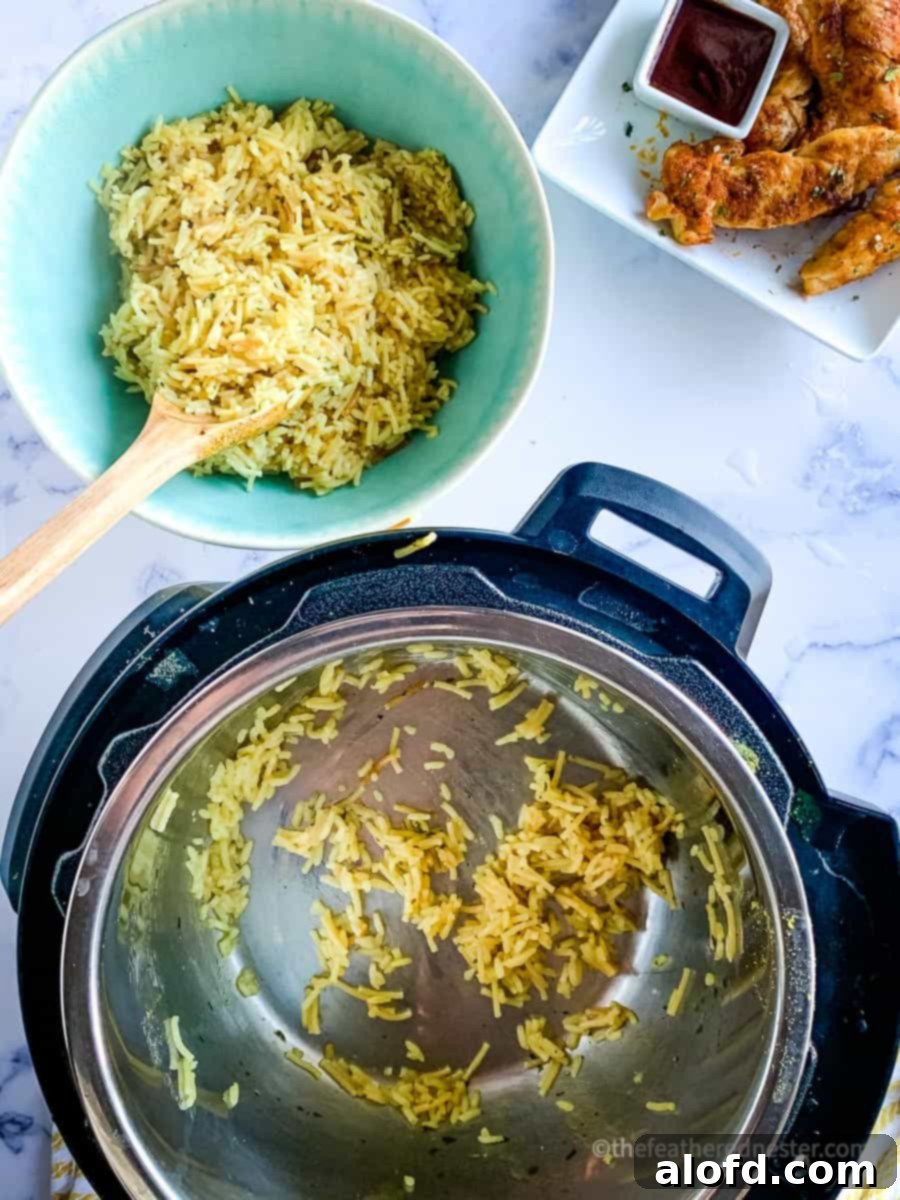 Perfect Instant Pot Rice A Roni 5 Transferring the rice from the Instant Pot to the green bowl with a wooden spoon.