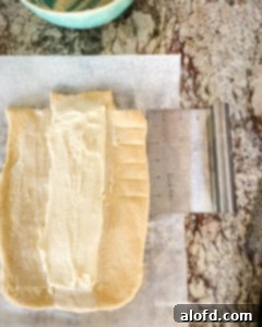 Frozen bread dough with cream cheese spread on.