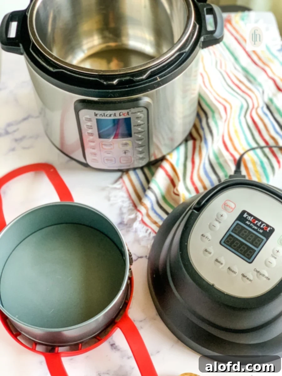 Creamy Instant Pot Cheesy Potatoes 7 6-quart Instant Pot Duo with air frying lid accessory next to a springform pan and silicone sling.