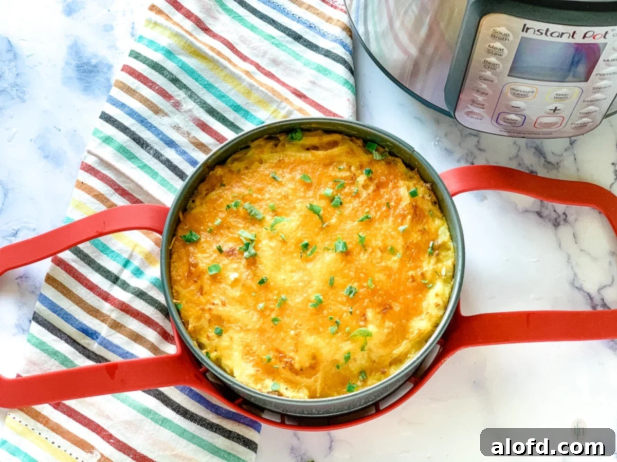 Creamy Instant Pot Cheesy Potatoes 9 Fully baked Instant Pot hash brown casserole topped with melted cheddar cheese.