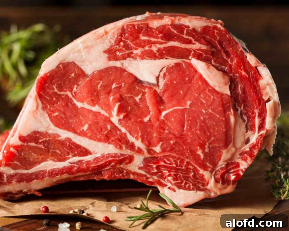 The Ultimate Prime Rib Roast 4 a close up of a beef rib roast to show the amount of marbling in the rib roast.