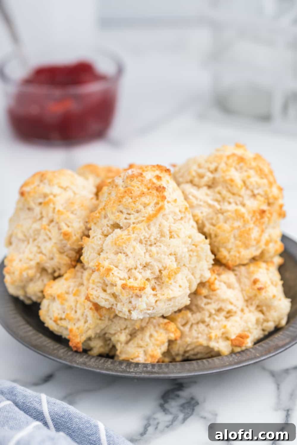 Homestyle Buttermilk Biscuits 2 A plate of fluffy, golden buttermilk biscuits, ready for serving.