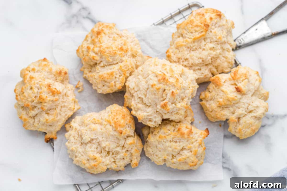 Homestyle Buttermilk Biscuits 10 Freshly baked buttermilk drop biscuits cooling on a wire rack, ready to be enjoyed.