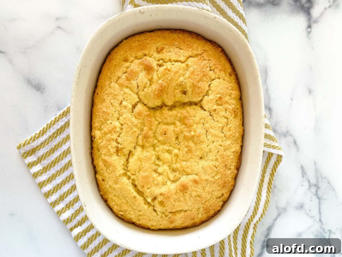 horizontal photo of a casserole with Jiffy cornbread with creamed corn.