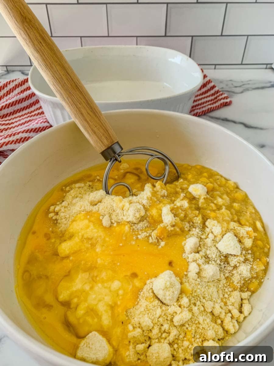 mixing all the ingredients in a large bowl using a whisk.