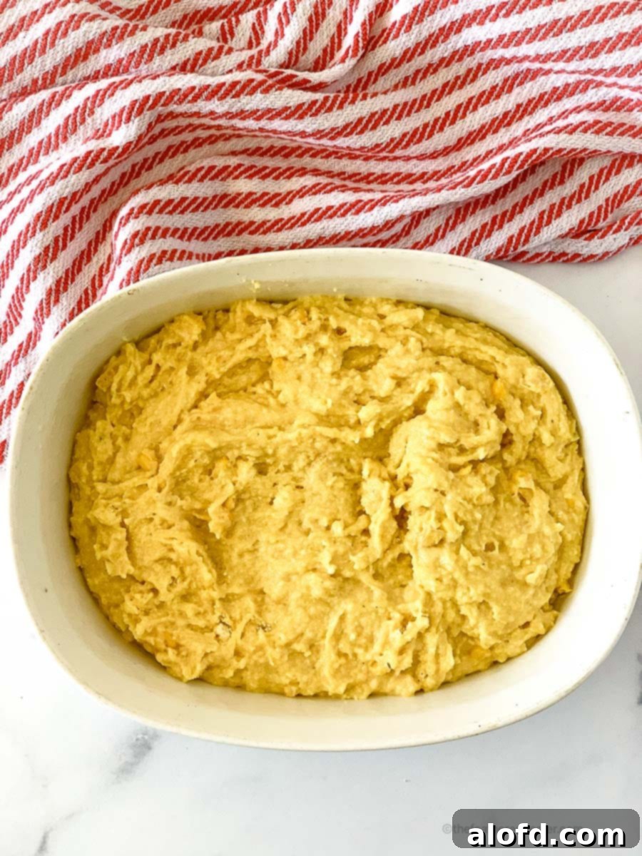 Jiffy cornbread with creamed corn in a casserole ready to bake.