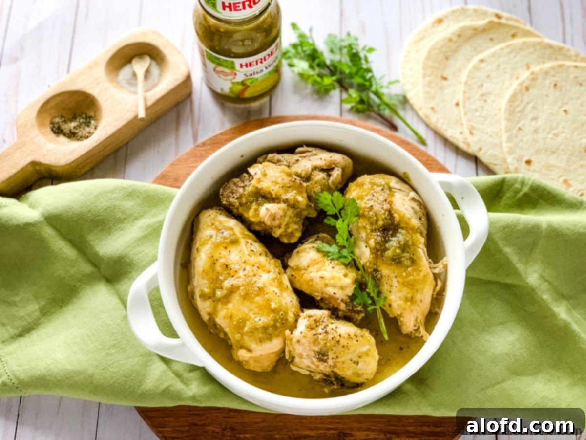 Easy Instant Pot Mexican Chicken 3 A white casserole dish of creamy Instant Pot chicken Chile verde ready to serve.