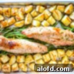 Roasted green beans, pork and potatoes on sheet pan.