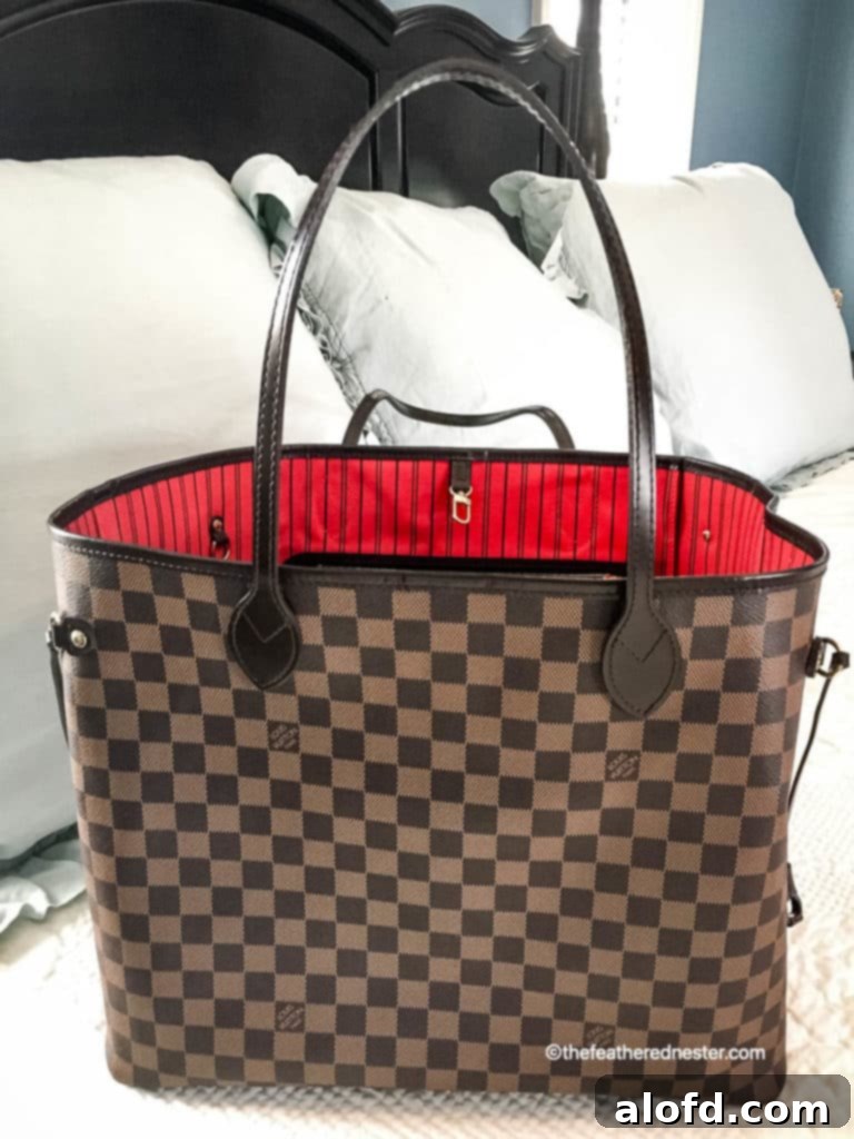 My Unfiltered Review of the Louis Vuitton Neverfull 11 A vibrant Louis Vuitton Neverfull tote with its signature cerise lining, ready for any occasion.