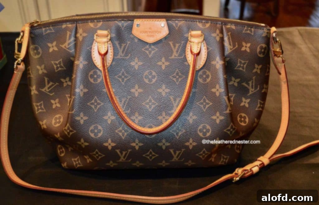 My Unfiltered Review of the Louis Vuitton Neverfull 9 The elegant Louis Vuitton Turenne MM handbag, showcasing its classic Monogram canvas and structured design.