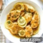 The Feathered Nester's Food Quest 5 Plated dish of lemon caper chicken cutlets, showcasing the vibrant and appetizing appearance of Chicken Piccata.