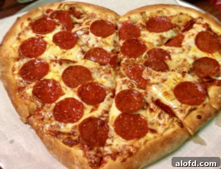 Homemade Romance 6 Heart-shaped pizza adorned with various toppings, a fun and romantic meal idea
