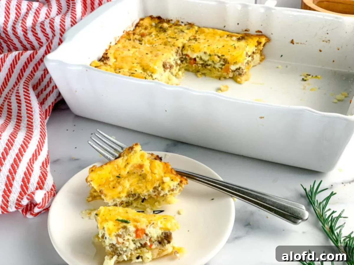 Ultimate Hash Brown Breakfast Bake 11 A large, golden-brown hash brown breakfast casserole in a baking dish, ready to be served.