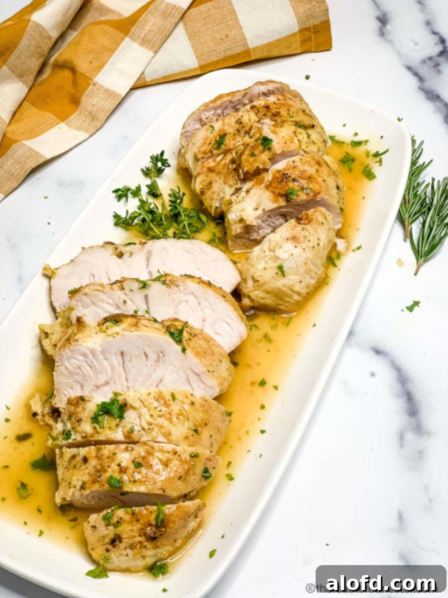 Juicy Instant Pot Turkey Tenderloin 8 Close-up image of a succulent Instant Pot Turkey Tenderloin, perfectly cooked and ready to be carved, showcasing its tender texture.