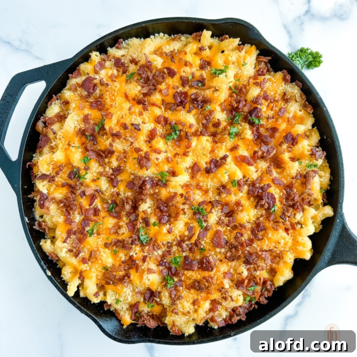 Skillet of smoked mac and cheese with bacon.