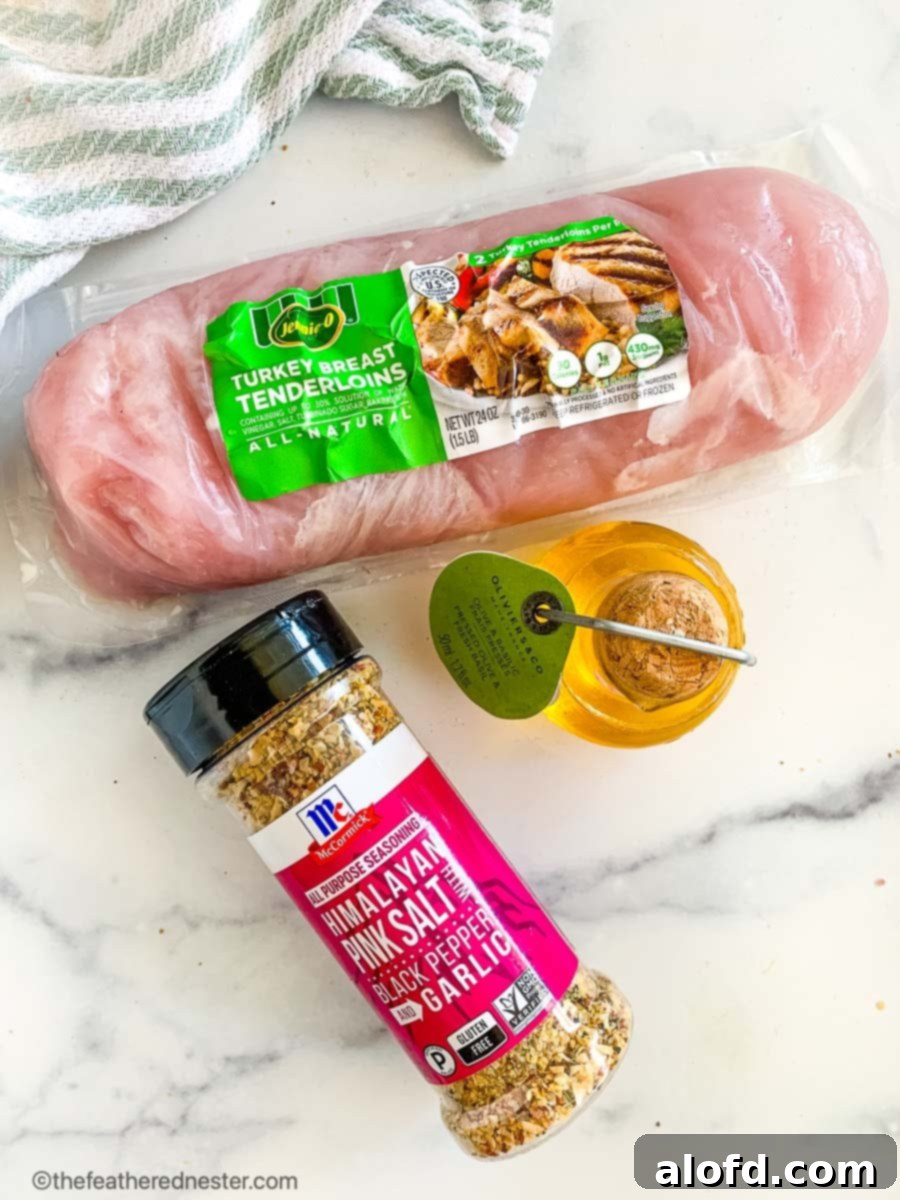 A package of boneless skinless turkey tenderloins, chicken broth, and marinade ingredients on a countertop.