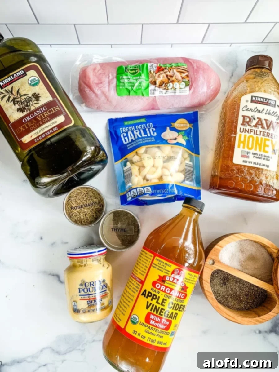 Crock pot turkey tenderloin ingredients laid out including spices, honey, vinegar, and broth.
