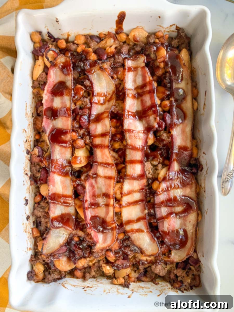 Vibrant Bean Medley Bake 7 a casserole dish of baked calico beans with bacon.