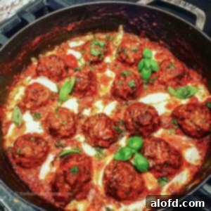 Hearty Meatball Marinara 7 pan fried meatball dinner cooking in a skillet.