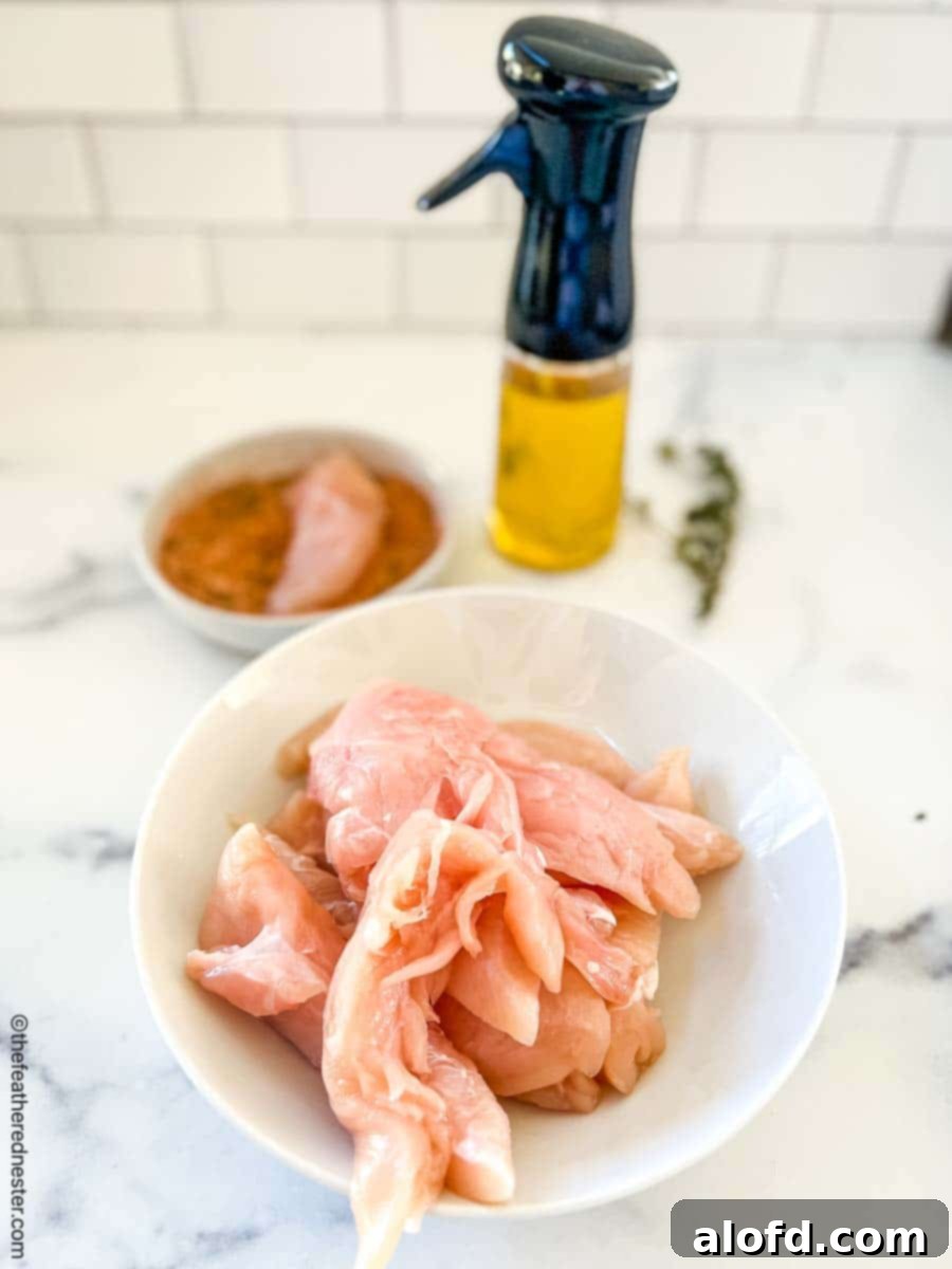 Cajun-Spiced Chicken Strips 6 bowl of raw chicken strips.